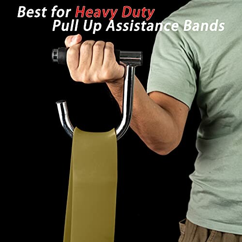 Person holding a heavy duty pull up assistance band with handle.