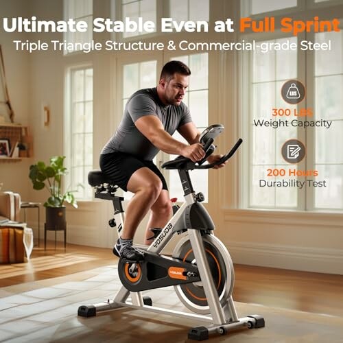 Man using a stable exercise bike in a living room.