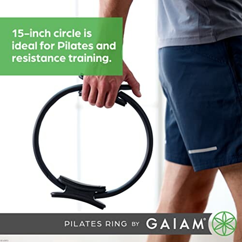 Person holding a Pilates ring for exercise