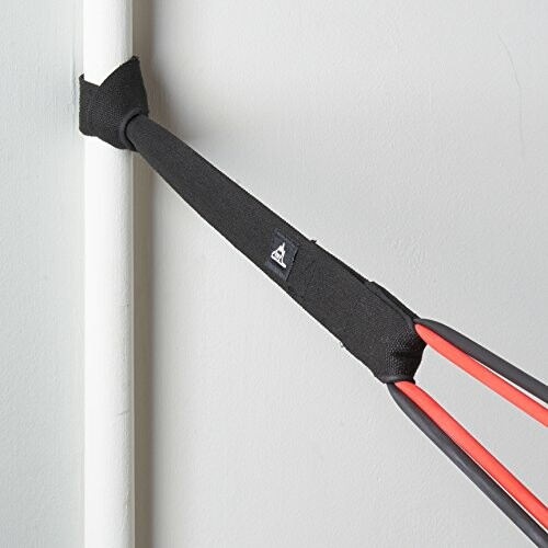 Resistance band anchored to a door