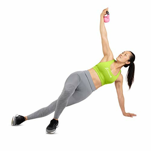 Woman performing a side plank with a kettlebell.