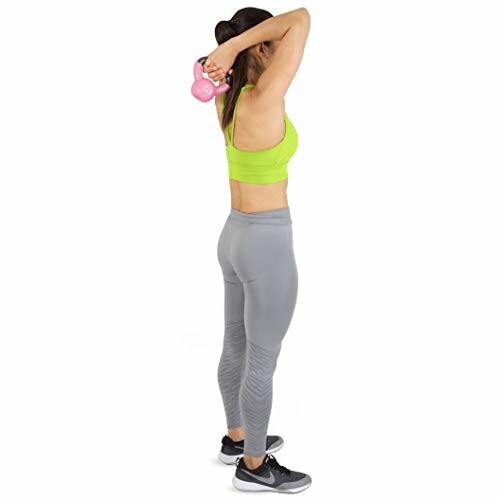 Woman in workout attire doing an exercise with a kettlebell.